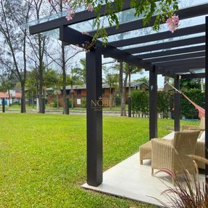 Casa com 518m², 5 dormitórios, 2 suítes, 2 vagas no bairro Praia Grande em Torres para Comprar