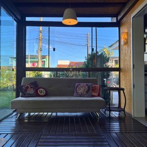 Casa com 184m², 3 dormitórios, 1 suíte, 2 vagas no bairro Igra Norte em Torres para Comprar