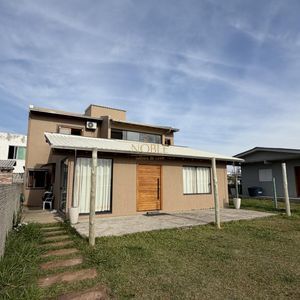 Casa com 159m², 4 dormitórios, 1 suíte no bairro Centro em Passo de Torres para Comprar