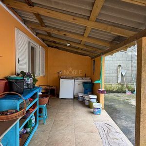 Casa com 101m², 2 dormitórios no bairro Igra Sul em Torres para Comprar