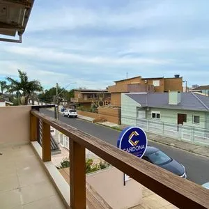 Casa com 272m², 4 dormitórios, 1 suíte, 3 vagas no bairro Igra Norte em Torres para Comprar
