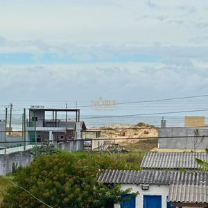 Casa com 180m², 3 dormitórios, 2 suítes, 2 vagas no bairro Caravelle em Passo de Torres para Comprar