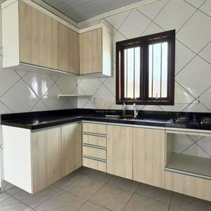 Casa com 74m², 2 dormitórios, 1 vaga no bairro Igra Sul em Torres para Comprar