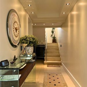 Casa com 600m², 4 dormitórios, 1 suíte, 4 vagas no bairro Igra Norte em Torres para Comprar