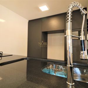 Sobrado com 220m², 5 dormitórios, 4 suítes, 3 vagas no bairro Stan em Torres para Comprar