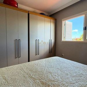 Casa com 209m², 3 dormitórios, 1 suíte, 2 vagas no bairro Igra em Torres para Comprar