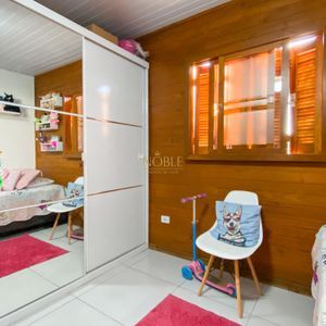 Casa com 102m², 2 dormitórios, 1 suíte, 2 vagas no bairro Igra Sul em Torres para Comprar