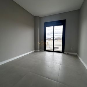Casa com 140m², 3 dormitórios, 1 suíte, 2 vagas no bairro Morada das Palmeiras em Torres para Comprar