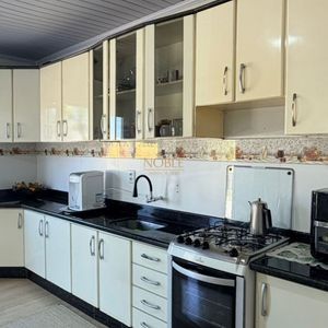 Casa com 125m², 4 dormitórios, 1 suíte, 2 vagas no bairro Vila São João em Torres para Comprar
