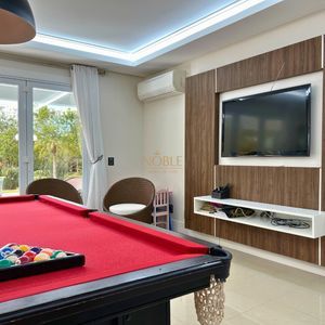 Casa com 600m², 4 dormitórios, 1 suíte, 4 vagas no bairro Igra Norte em Torres para Comprar