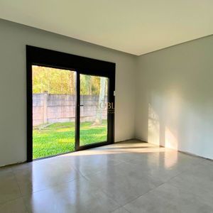 Casa com 201m², 3 dormitórios, 3 suítes, 2 vagas no Reserva das Águas em Torres para Comprar