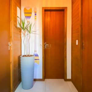 Casa com 102m², 2 dormitórios, 1 suíte, 2 vagas no bairro Igra Sul em Torres para Comprar