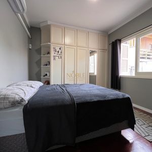 Casa com 184m², 3 dormitórios, 1 suíte, 2 vagas no bairro Igra Norte em Torres para Comprar