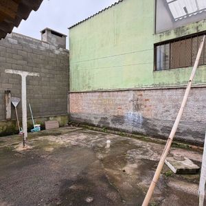 Casa com 101m², 2 dormitórios no bairro Igra Sul em Torres para Comprar
