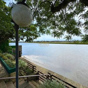 Casa com 220m², 4 dormitórios, 4 suítes, 2 vagas no bairro Igra Norte em Torres para Comprar