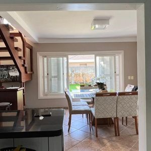 Sobrado com 290m², 4 dormitórios, 1 suíte, 2 vagas no bairro Igra Norte em Torres para Comprar
