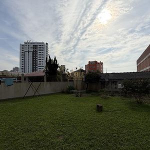 Casa com 252m², 5 dormitórios, 1 suíte, 2 vagas no bairro Centro em Torres para Comprar