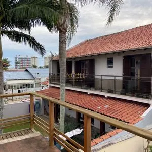 Casa com 272m², 4 dormitórios, 1 suíte, 3 vagas no bairro Igra Norte em Torres para Comprar
