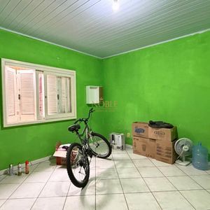Casa com 101m², 2 dormitórios no bairro Igra Sul em Torres para Comprar