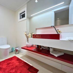 Casa com 600m², 4 dormitórios, 1 suíte, 4 vagas no bairro Igra Norte em Torres para Comprar