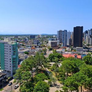 Apartamento com 76m², 2 dormitórios, 1 suíte, 2 vagas no Vesta em Torres para Comprar