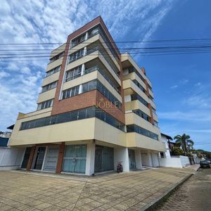 Apartamento com 90m², 2 dormitórios, 1 suíte, 1 vaga no Edifício San Dilin em Torres para Comprar