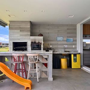 Casa de Condomínio com 348m², 4 dormitórios, 3 suítes, 2 vagas no Condomínio Ilhas Park em Torres para Comprar