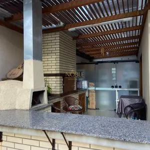 Casa com 272m², 4 dormitórios, 1 suíte, 3 vagas no bairro Igra Norte em Torres para Comprar