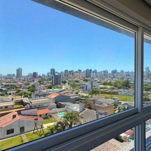 Apartamento com 70m², 2 dormitórios, 1 suíte, 1 vaga no Topazio em Torres para Comprar