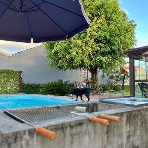 Casa com 184m², 3 dormitórios, 1 suíte, 2 vagas no bairro Igra Norte em Torres para Comprar