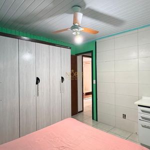 Casa com 130m², 2 dormitórios, 2 vagas no bairro Praia da Cal em Torres para Comprar