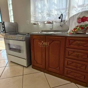 Casa com 145m², 3 dormitórios, 1 suíte, 2 vagas no bairro Igra Sul em Torres para Comprar