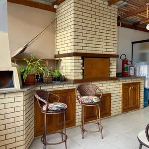 Casa com 272m², 4 dormitórios, 1 suíte, 3 vagas no bairro Igra Norte em Torres para Comprar