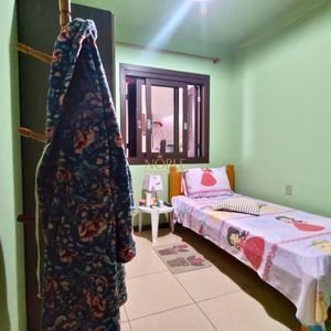 Casa, 6 dormitórios, 2 suítes, 3 vagas no bairro Getúlio Vargas em Torres para Comprar