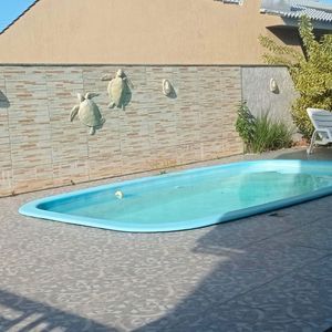 Casa com 500m², 4 dormitórios, 4 suítes, 2 vagas no bairro Bella Torres em Passo de Torres para Comprar