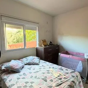 Casa com 172m², 3 dormitórios, 1 suíte, 2 vagas no bairro São Jorge em Torres para Comprar