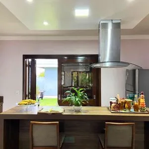 Casa com 148m², 3 dormitórios, 1 suíte, 2 vagas no bairro Morada das Palmeiras em Torres para Comprar