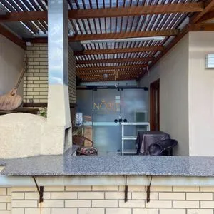 Casa com 272m², 4 dormitórios, 1 suíte, 3 vagas no bairro Igra Norte em Torres para Comprar