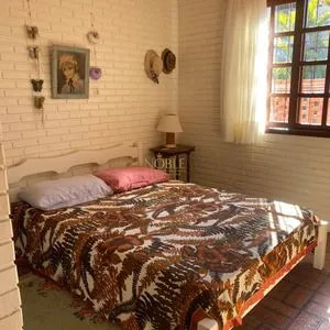 Casa com 247m², 5 dormitórios, 3 suítes, 3 vagas no bairro Praia Grande em Torres para Comprar