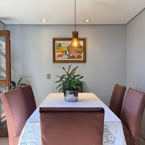 Casa com 228m², 3 dormitórios, 1 suíte, 2 vagas no bairro Stan em Torres para Comprar