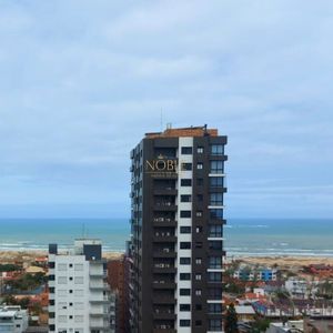 Apartamento com 83m², 2 dormitórios, 1 suíte, 2 vagas no Mirage em Torres para Comprar