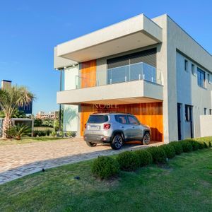 Casa de Condomínio com 375m², 4 dormitórios, 4 suítes, 2 vagas no Condomínio Ilhas Park em Torres para Comprar