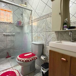 Casa com 101m², 2 dormitórios no bairro Igra Sul em Torres para Comprar