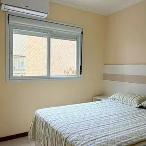 Apartamento com 127m², 3 dormitórios, 1 suíte, 2 vagas no Elegance em Torres para Comprar