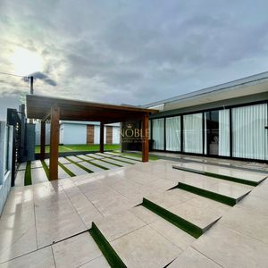 Casa com 670m², 5 dormitórios, 3 suítes, 3 vagas no bairro Bellatorres em Passo de Torres para Comprar