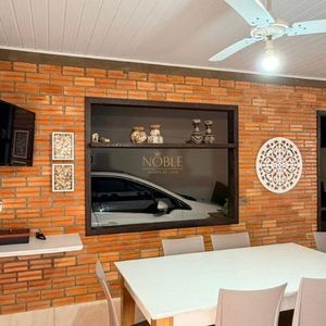 Casa com 98m², 3 dormitórios, 2 vagas no bairro Praia da Cal em Torres para Comprar