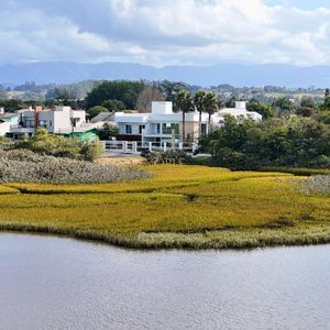 Casa com 600m², 4 dormitórios, 1 suíte, 4 vagas no bairro Igra Norte em Torres para Comprar