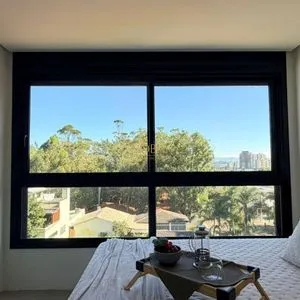 Apartamento com 64m², 2 dormitórios, 1 suíte, 1 vaga no Aston em Torres para Comprar