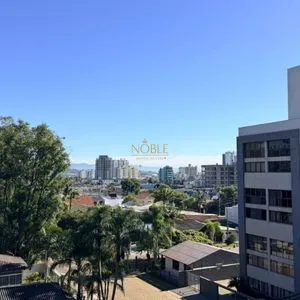 Apartamento com 64m², 2 dormitórios, 1 suíte, 1 vaga no Aston em Torres para Comprar