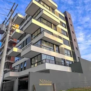 Apartamento com 64m², 2 dormitórios, 1 suíte, 1 vaga no Aston em Torres para Comprar